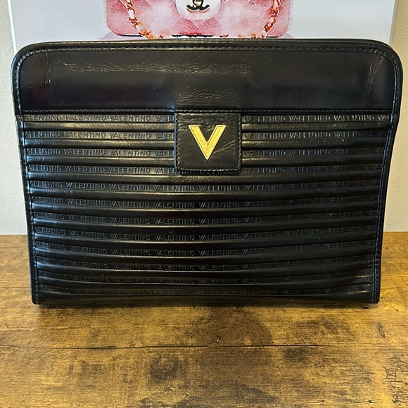 Valentino Handbags - Valentino EUC black leather clutch